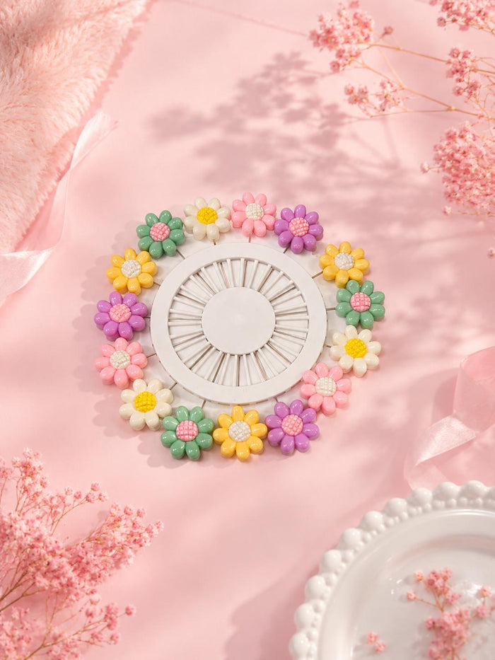 Daisy flower sewing pins pink background