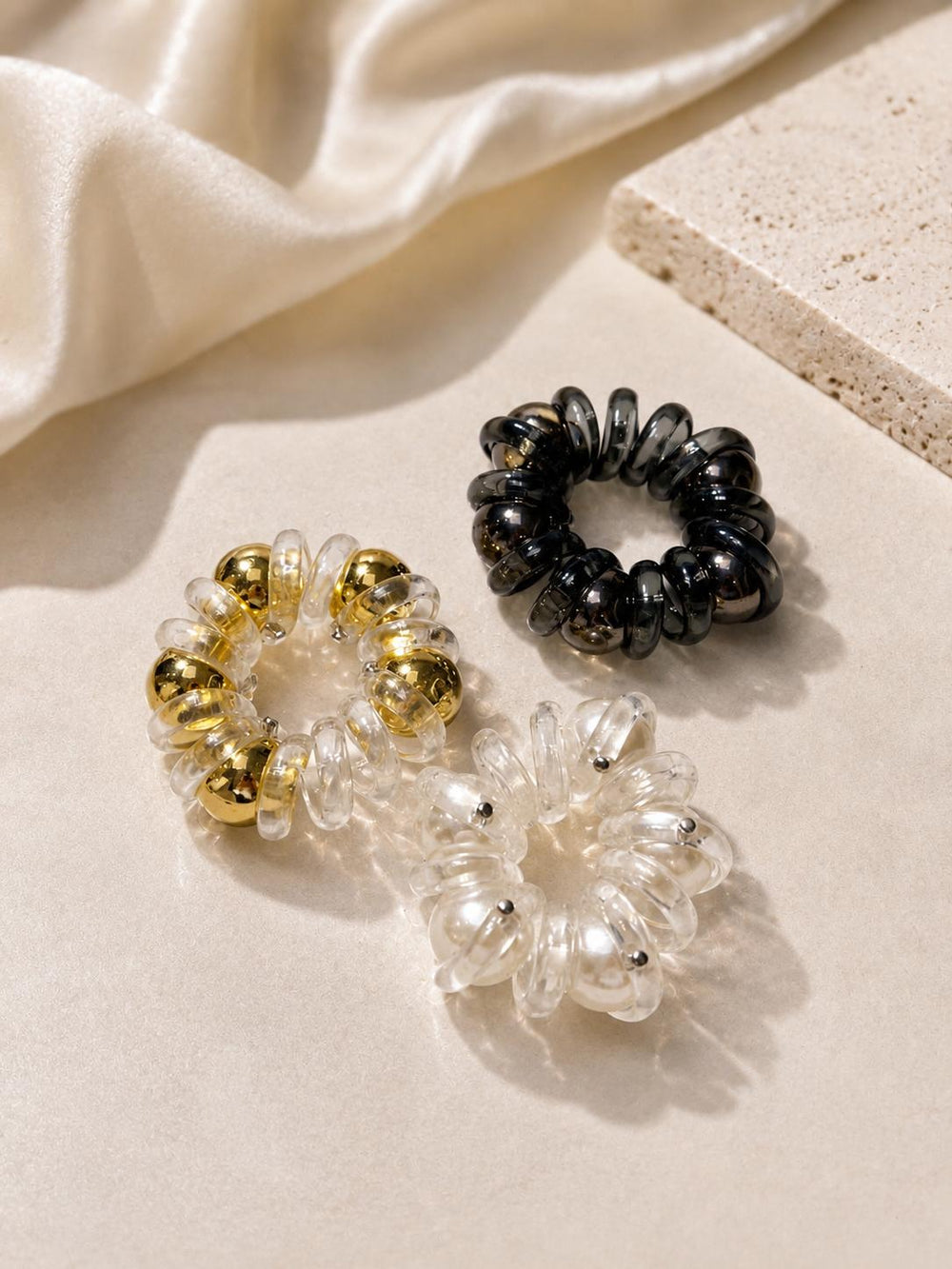 Metallic bead spiral hair ties close