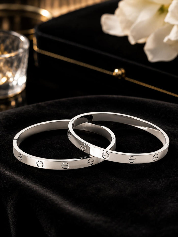 Love screw bangle bracelet pair on velvet