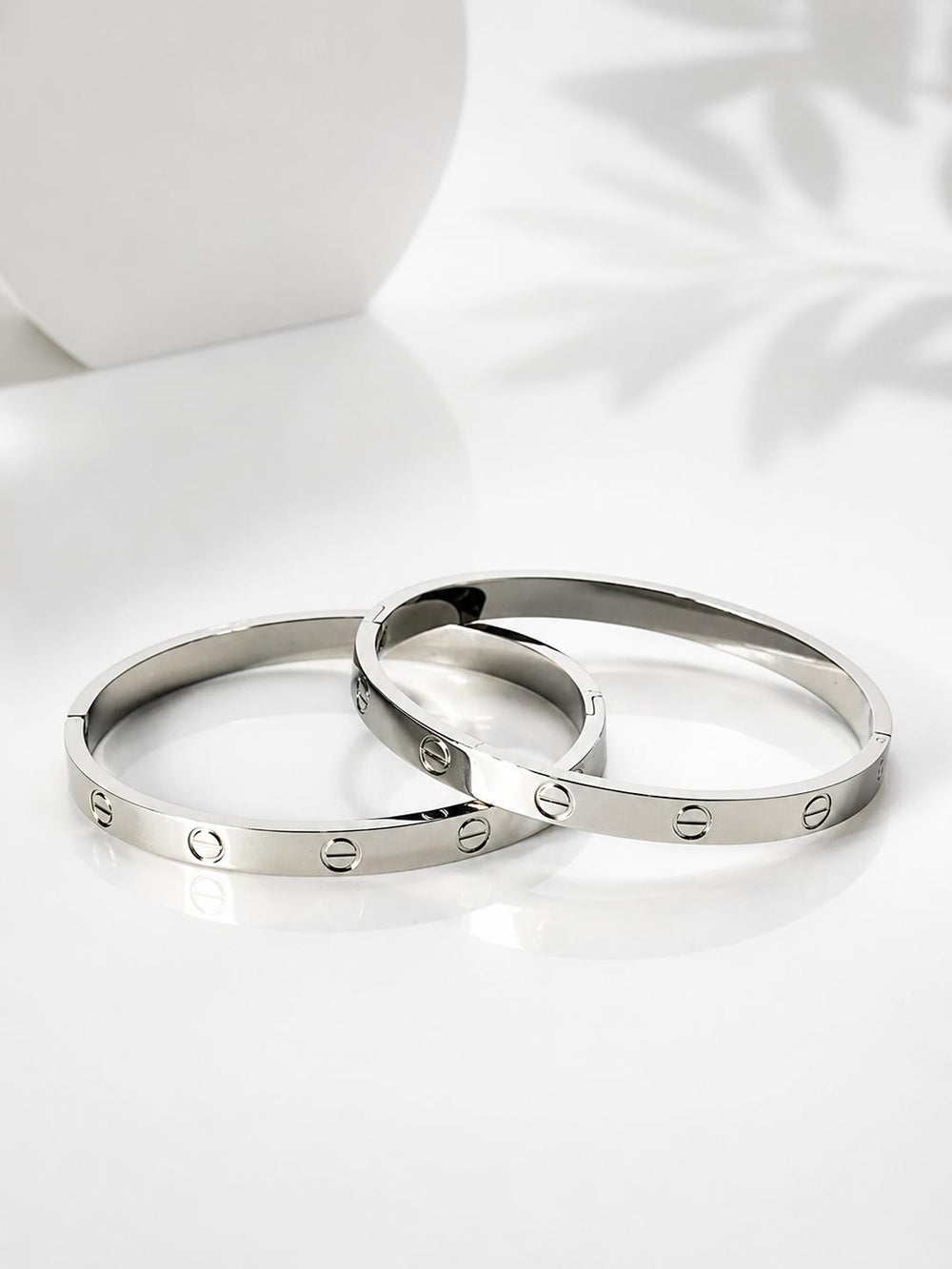 Love screw bangle bracelet pair white background