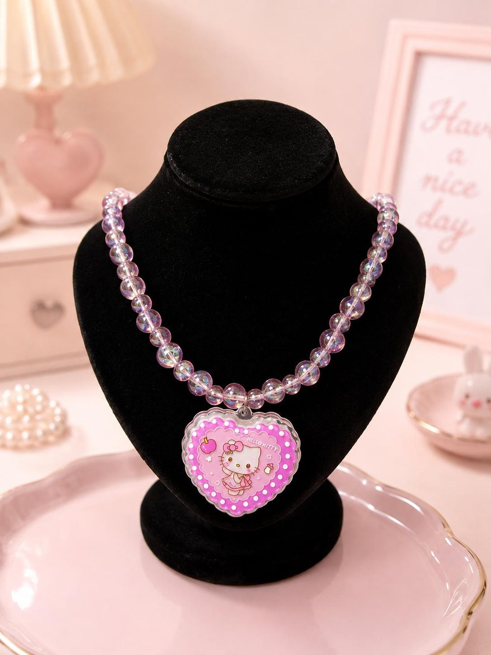 Hello Kitty necklace on stand
