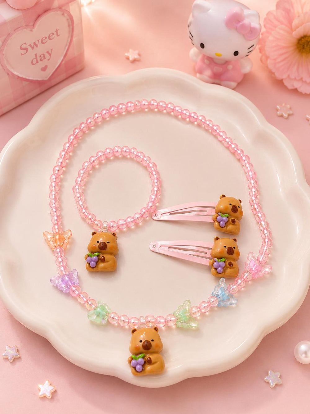Bear charm jewelry set on plate